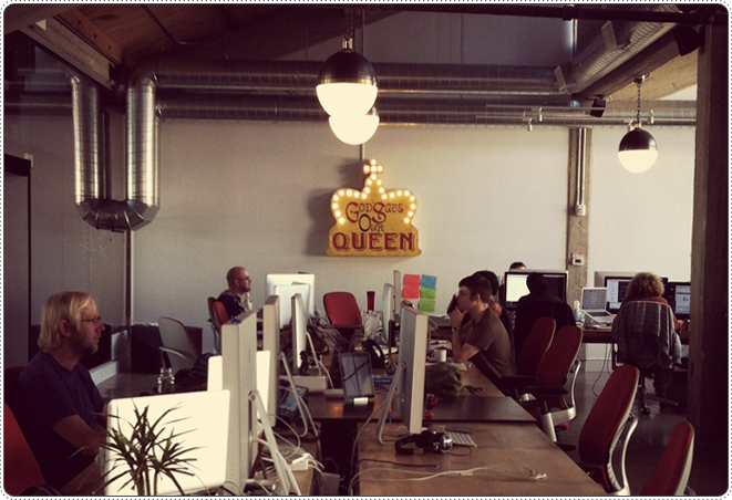 The Monkey Inferno office in San Francisco, with a "God Save Our Queen" neon sign on the wall