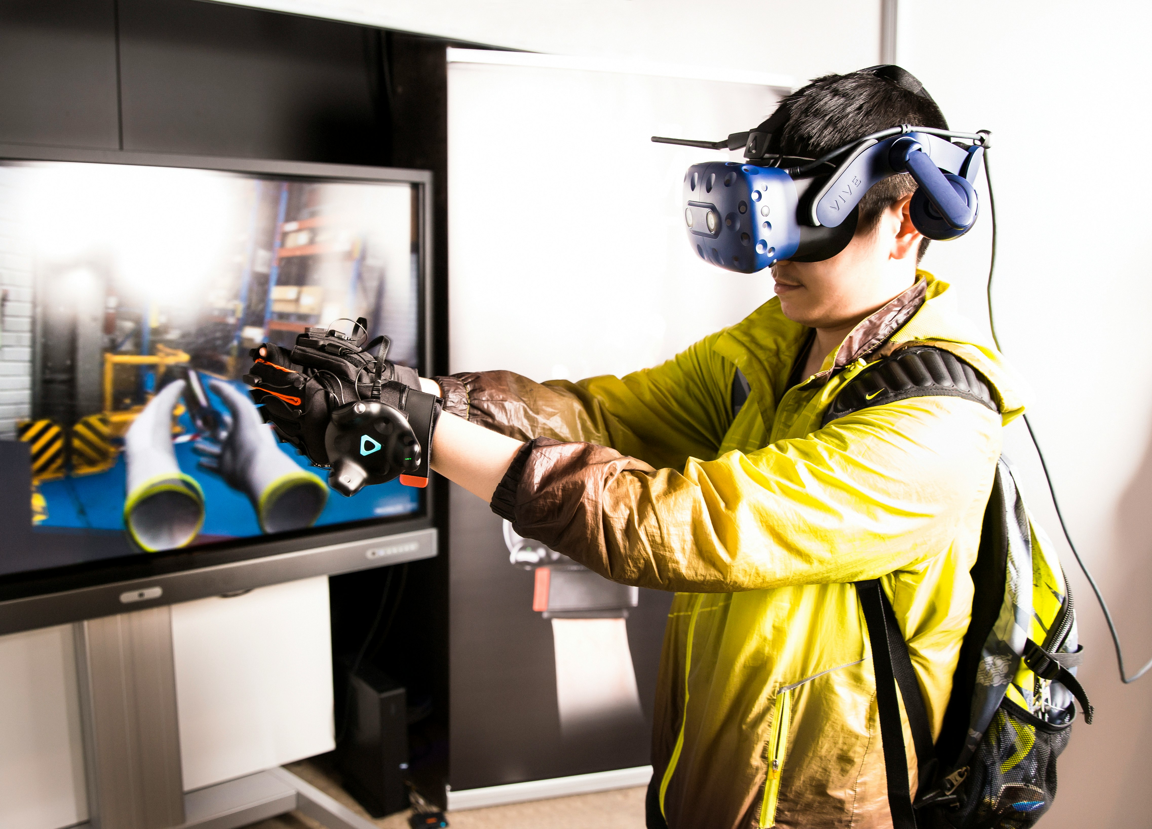 Attendees exploring XR hardware and interactions at XR Expo